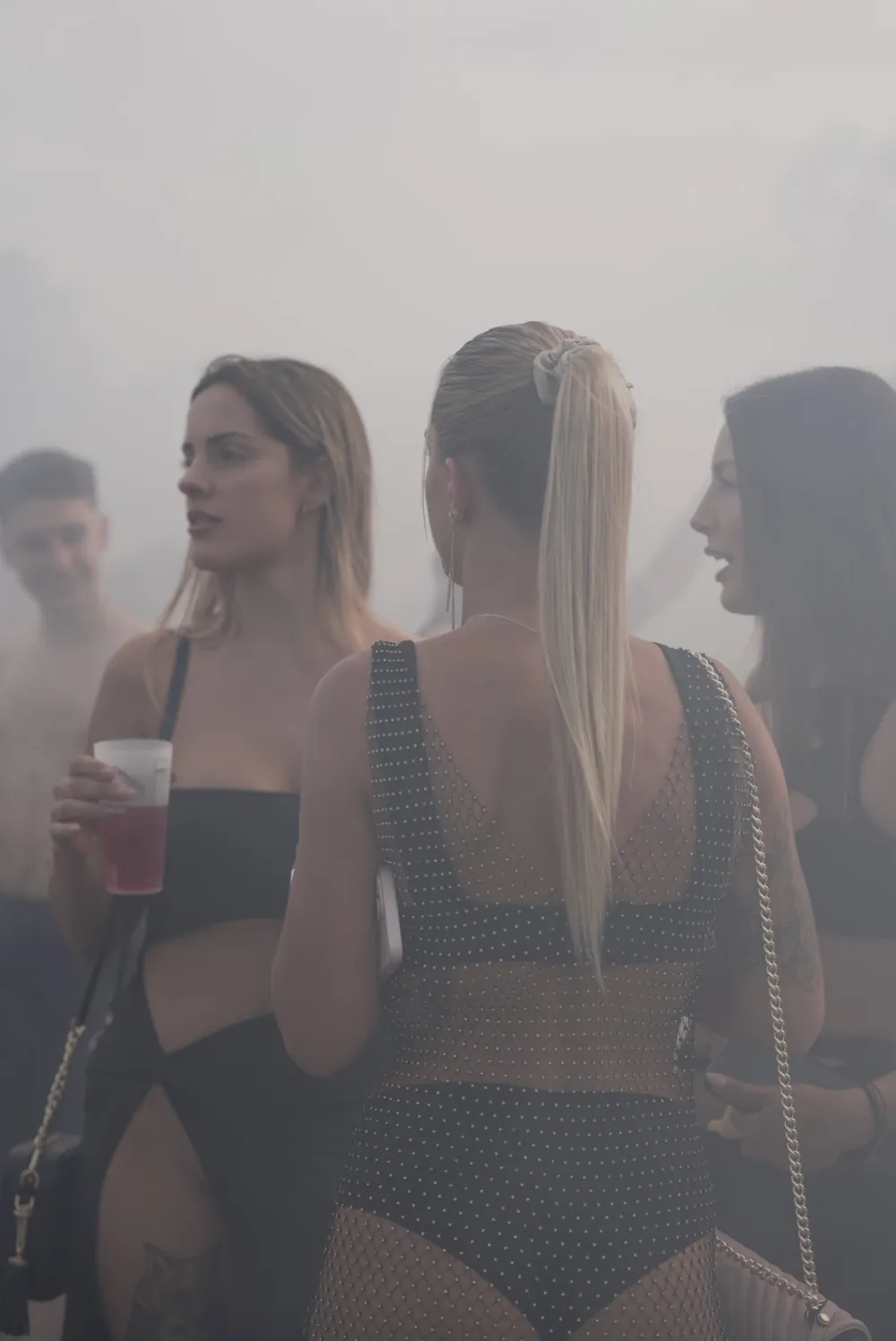 Unedited frame of the same group a second later, washed out by the smoke