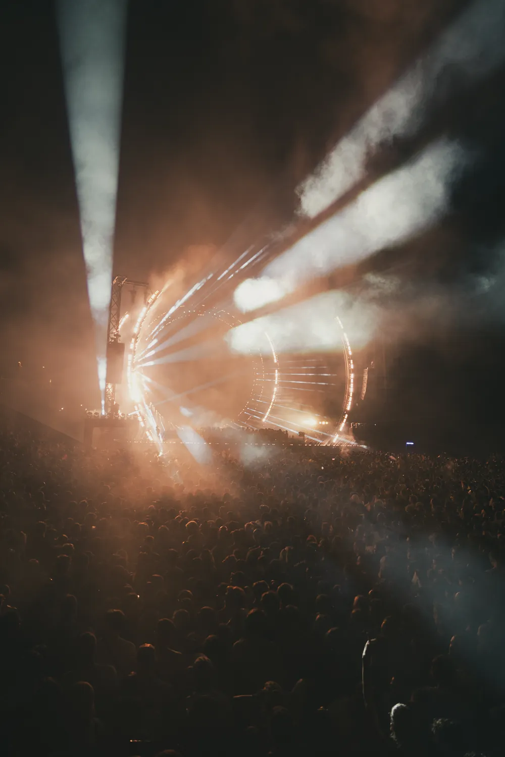 Edited frame of the same stage with warm orange light, neutral shadows and softer highlights
